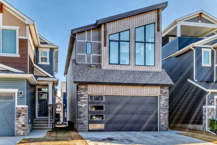 Property Photo: 138 Silver Spruce Grove SW AB T2X 5M2