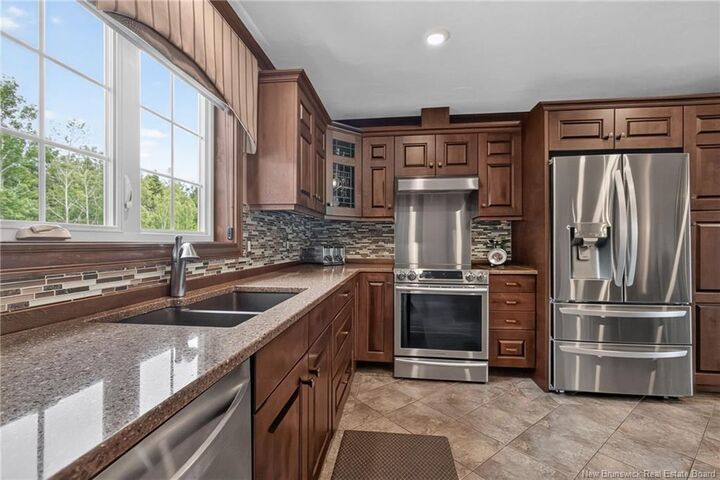 Property Photo:  115 Royal Oaks Boulevard  NB E1H 2P7 