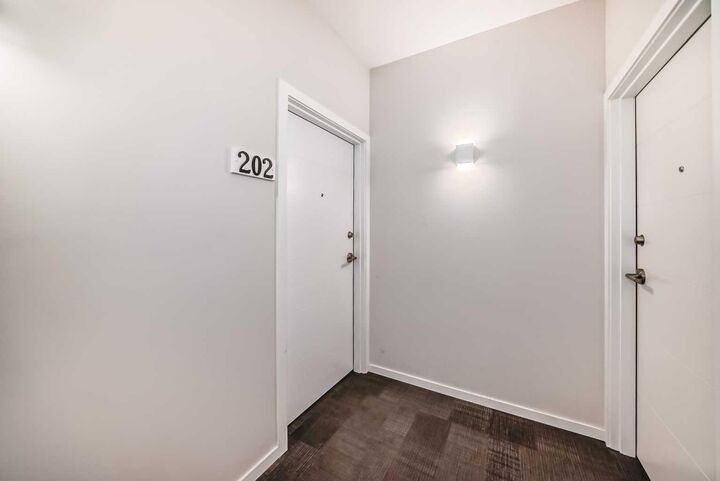 Property Photo: 245 Redstone Walk NE 202 AB T3N 1M6