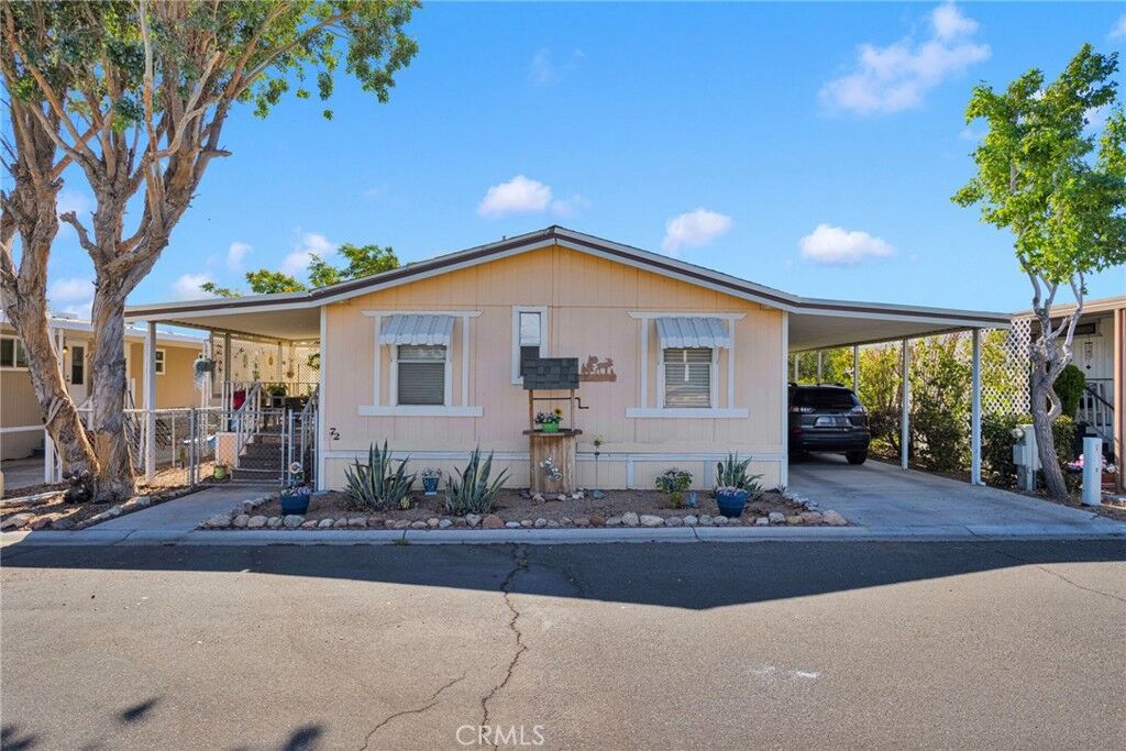 Property Photo:  9161 Santa Fe E 72  CA 92345 