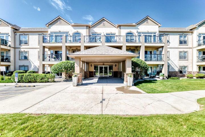 Property Photo: 303 Arbour Crest Drive NW 2215 AB T3G 5G4