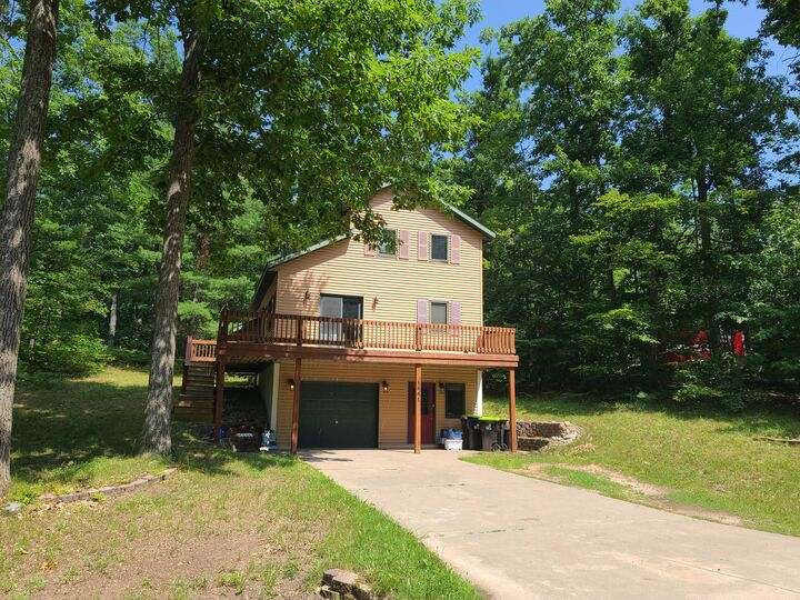 Property Photo:  5861 Arawak Pass  MI 49735 