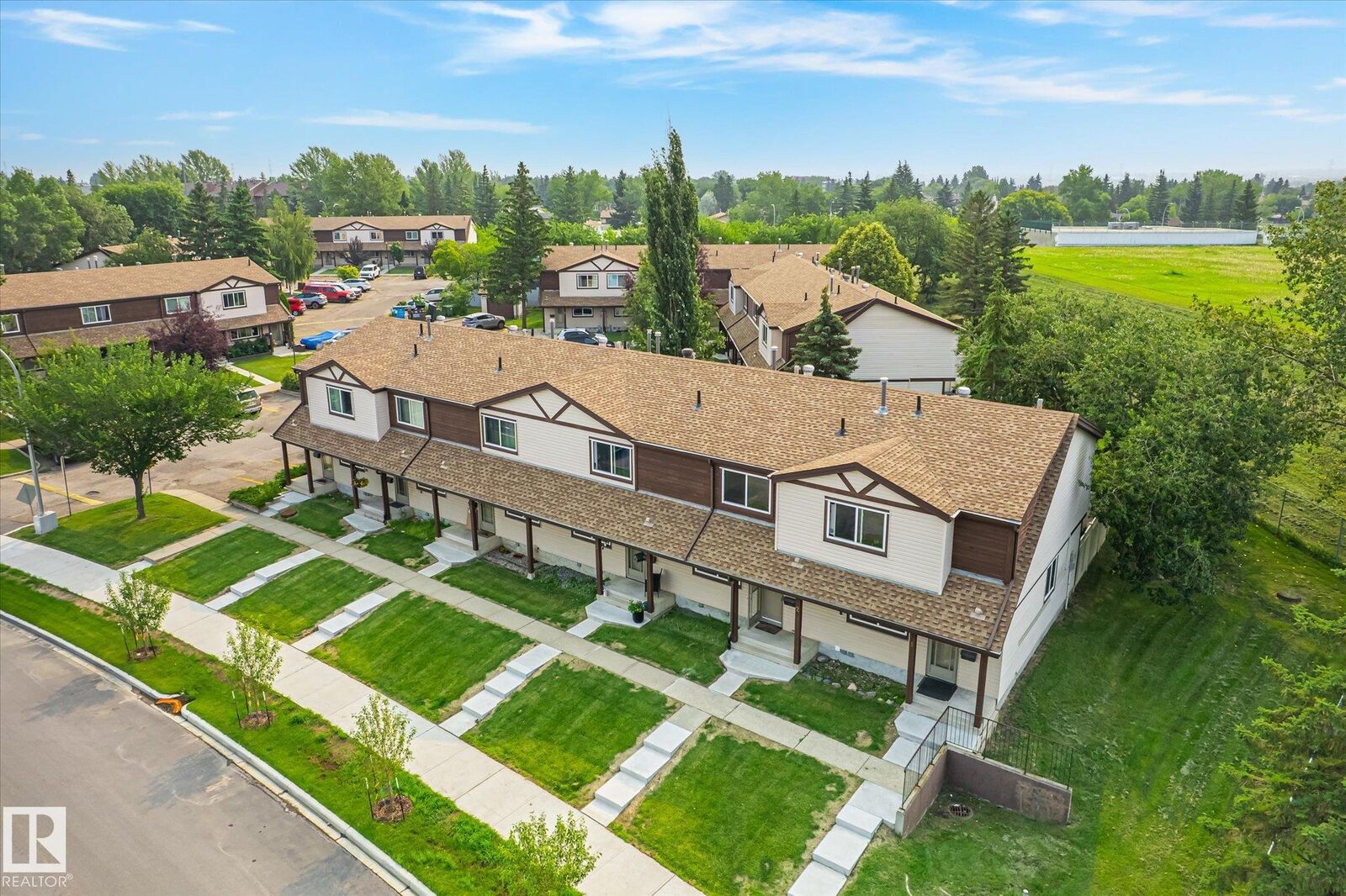 Property Photo:  13833 30 Street NW 2  AB T5Y 2B2 