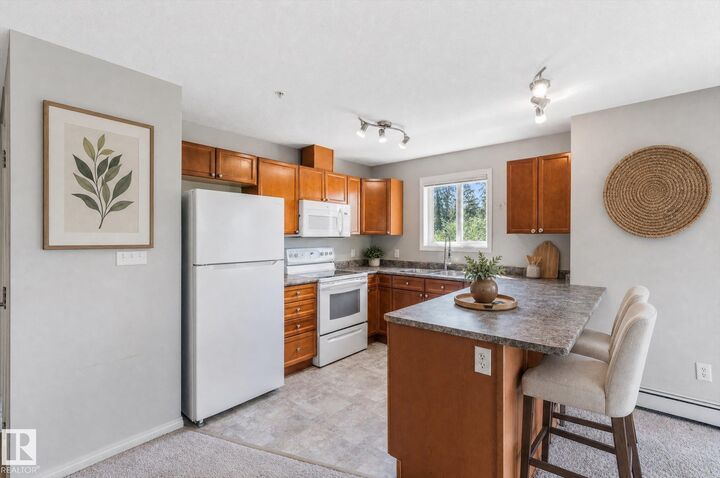 Property Photo:  4903 47 Avenue 208  AB T7Z 0C8 