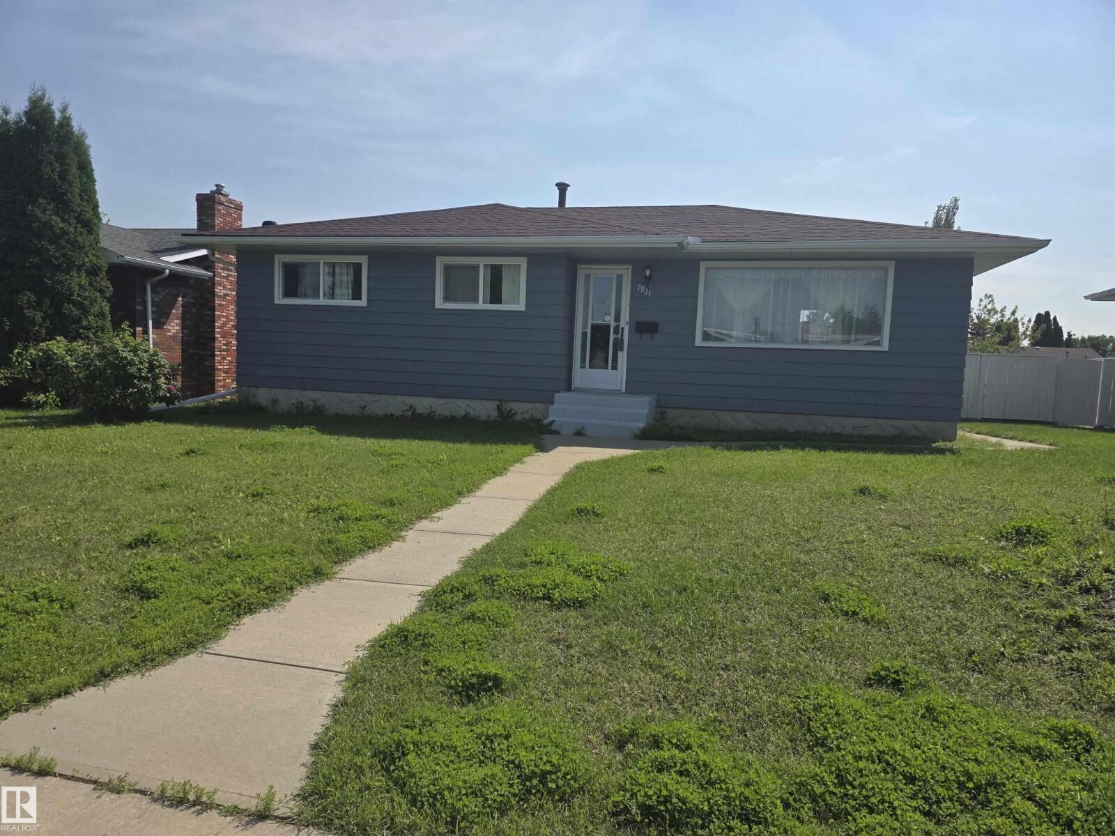 Property Photo:  7911 145 Av NW NW  AB T5C 2S8 