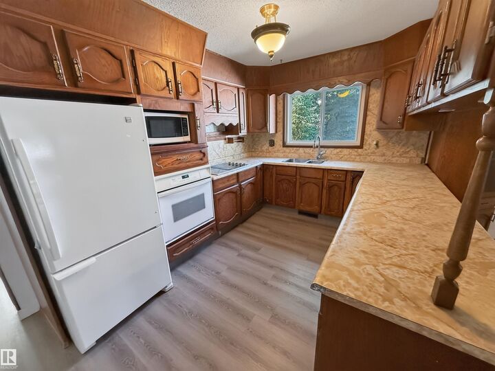 Property Photo: 11327 25 Avenue NW AB T6J 5J1
