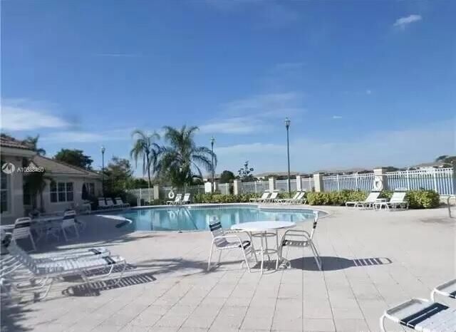 Property Photo:  5045 Wiles Road 308  FL 33073 
