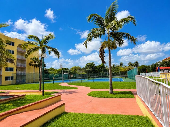 Property Photo:  6980 NW 186th Street 3-523A  FL 33015 