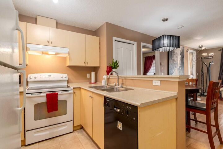 Property Photo:  8 Bridlecrest Drive SW 2128  AB T2Y 0H7 
