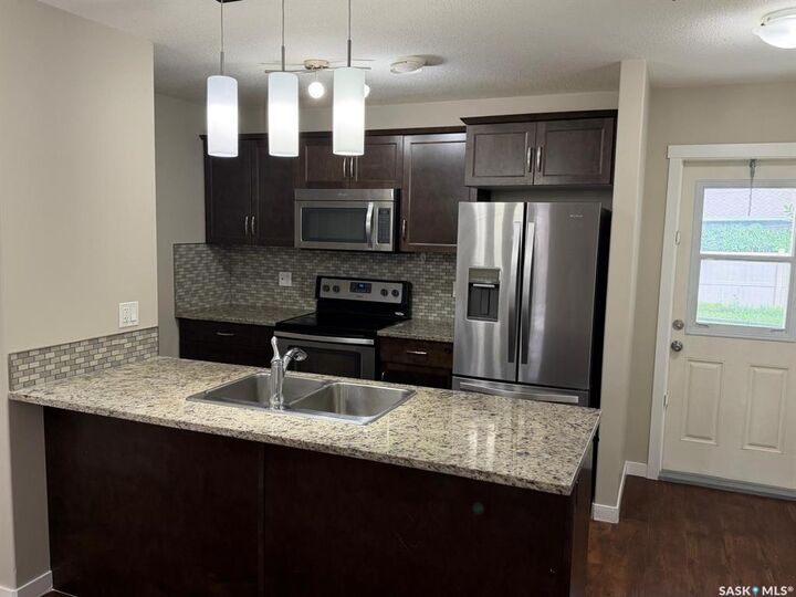 Property Photo: 3440 Avonhurst Drive 604 SK S4R 2E1