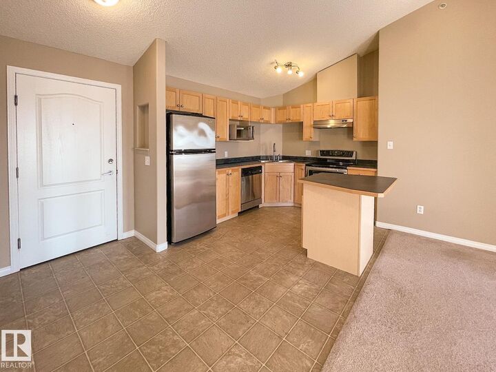 Property Photo:  5350 199 Street NW 409  AB T6M 0A4 