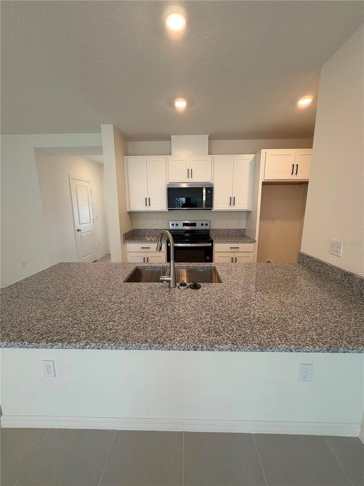 Property Photo: 16631 Luminary Loop FL 34714