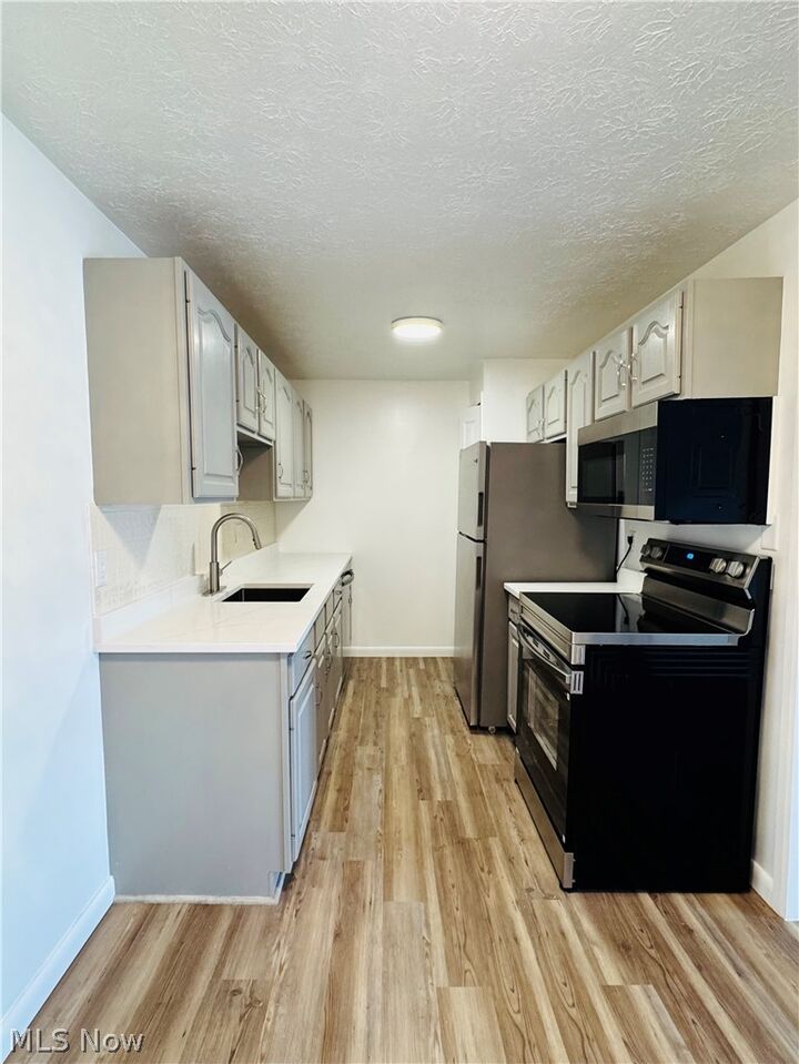 Property Photo: 9911 Sunrise Boulevard Q10 OH 44133