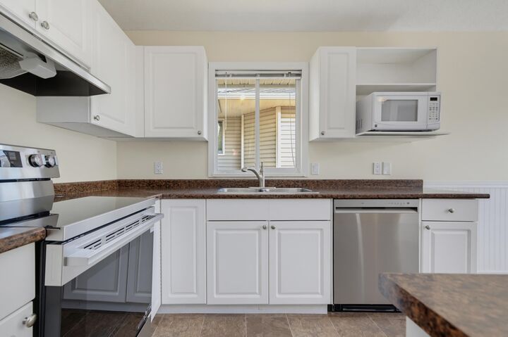 Property Photo:  21928 48 Avenue 8  BC V3A 8H1 
