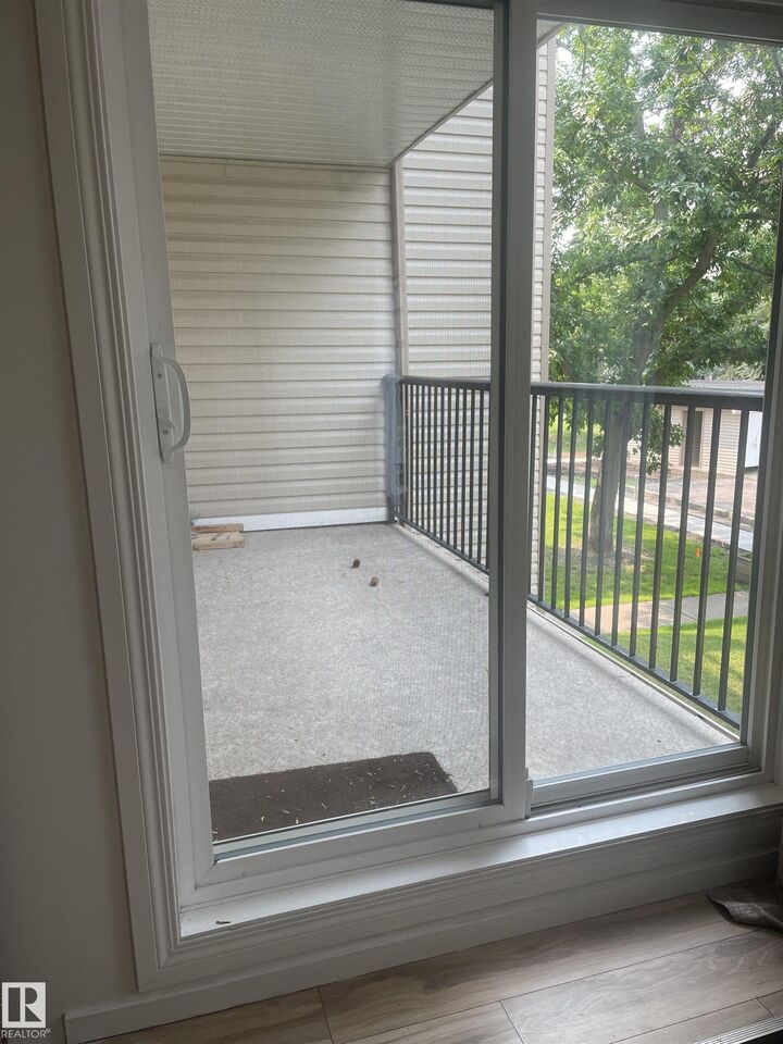 Property Photo: 9810 178 Street NW 208 AB T5T 3H4