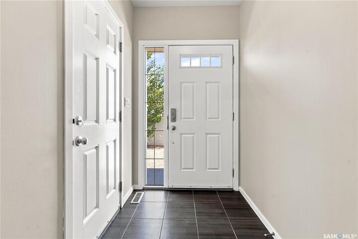 Property Photo: 3303 Green Sandcherry Street SK S4V 3M2