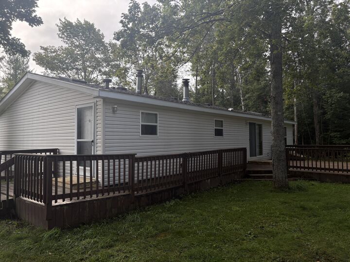 Property Photo:  122 Crockett Road  MI 49707 