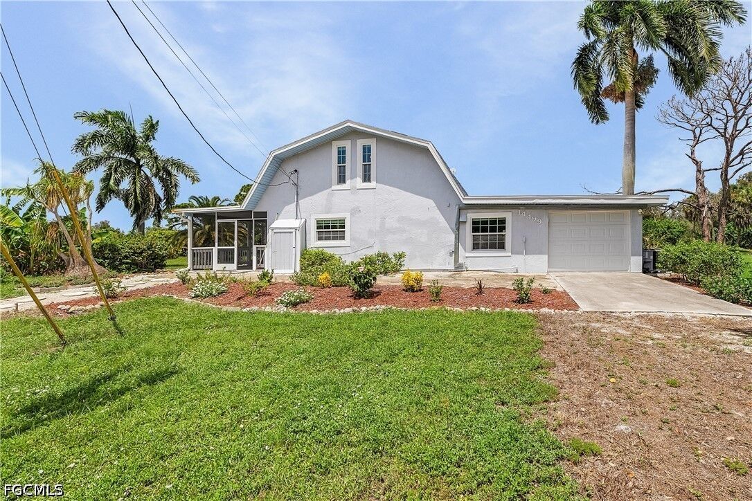 Property Photo: 14499 Windsong Lane FL 33922