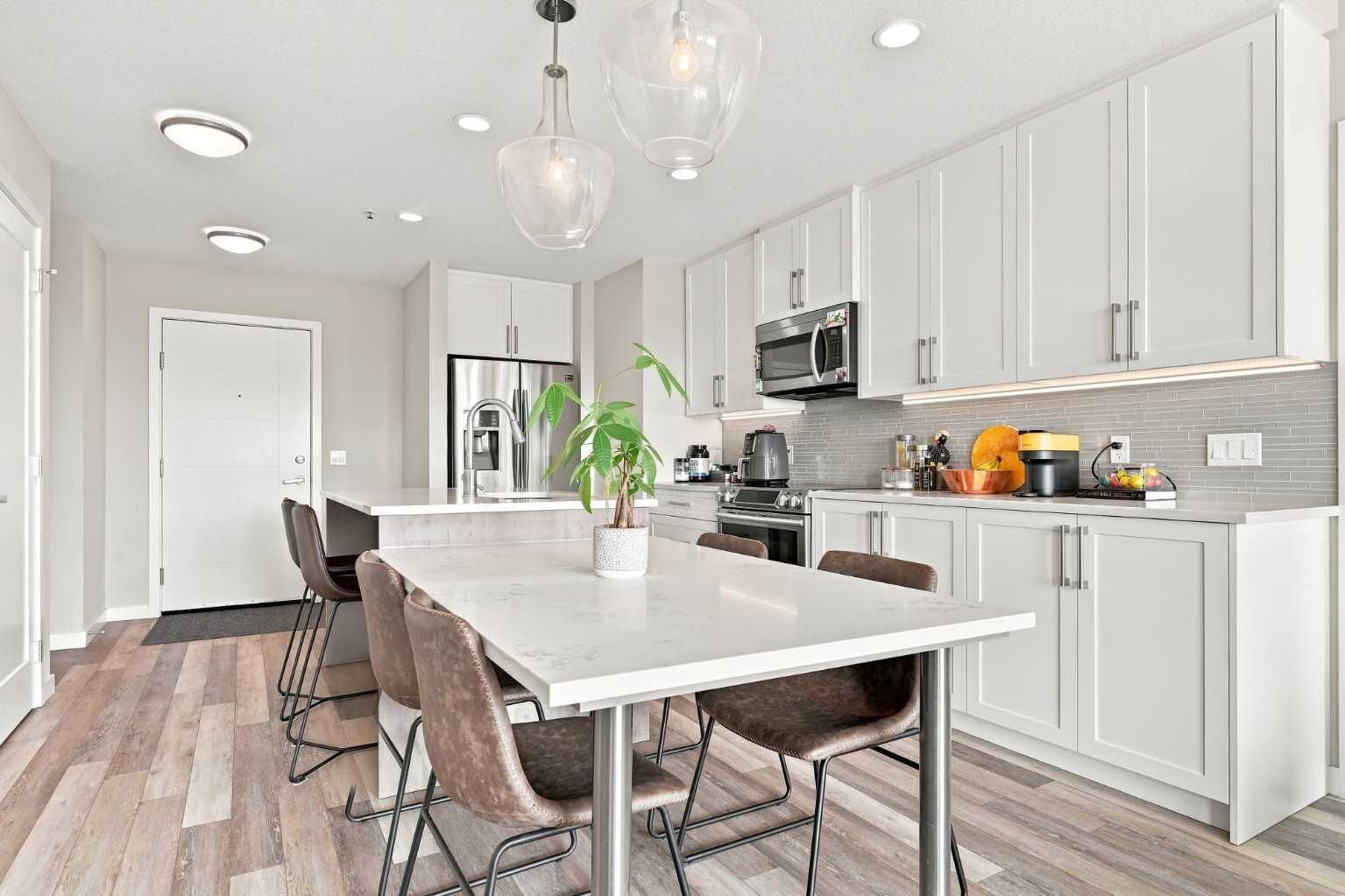 Property Photo: 8530 8A Avenue SW 320 AB T3H 6A7