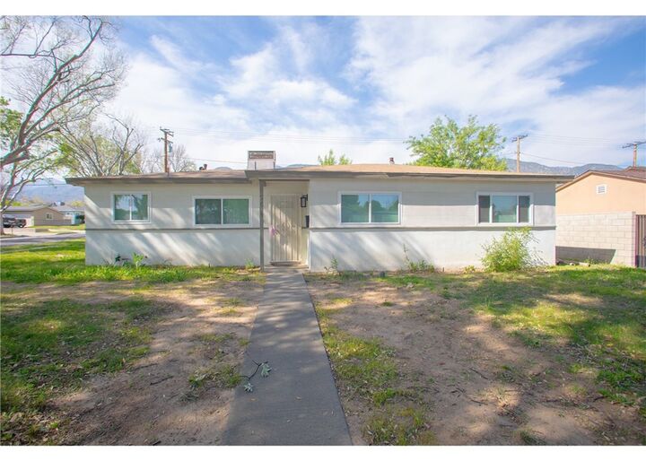 Property Photo:  496 W 48th  CA 92407 