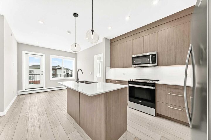 Property Photo:  6 Merganser Drive West 1406  AB T1X 2Y2 