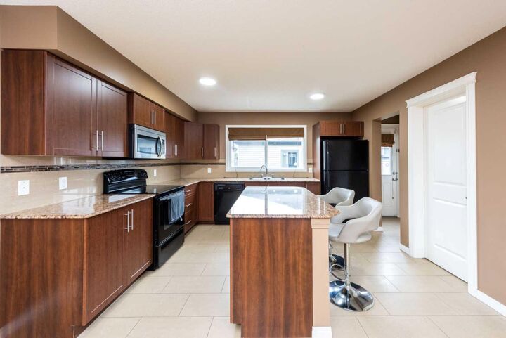 Property Photo:  212 Panatella Drive NW  AB T3K 0T4 