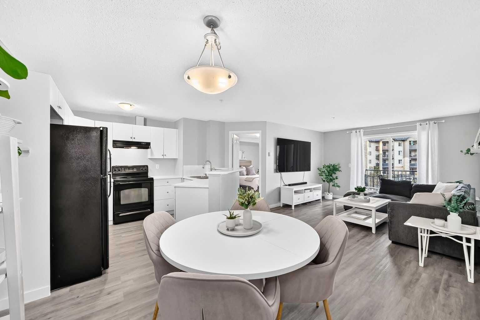 Property Photo:  304 Mackenzie Way SW 7205  AB T4B 3H7 