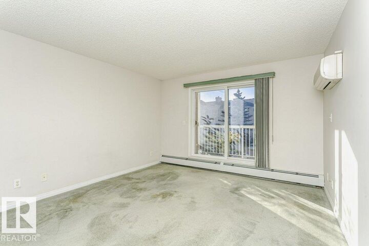 Property Photo:  4210 139 Avenue NW 324  AB T5Y 2W6 