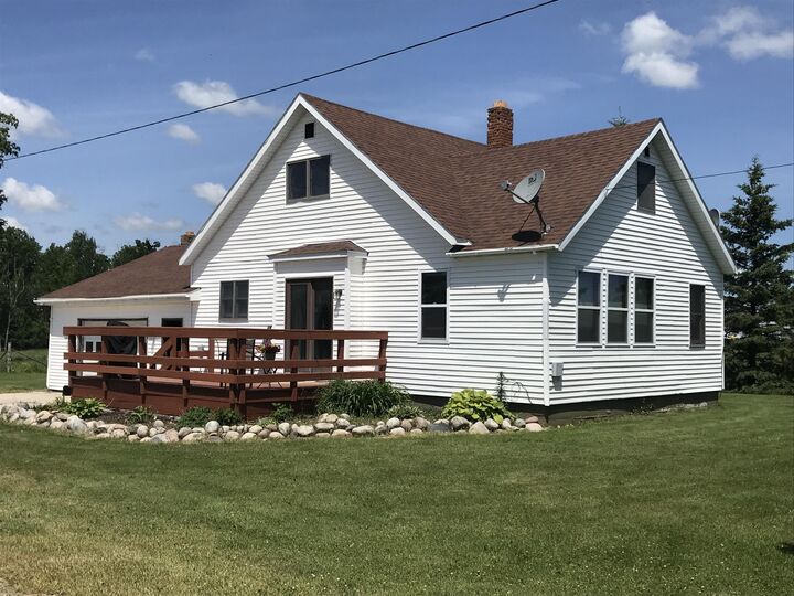 Property Photo:  7338 M-129  MI 49774 
