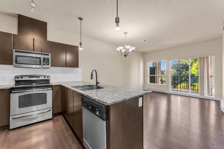 Property Photo: 9655 King George Boulevard 409 BC V3T 0C7
