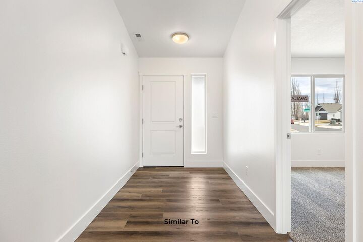 Property Photo:  10211 Redbud Dr  WA 99301 