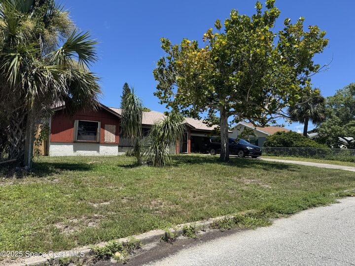Property Photo: 496 Poinciana Drive FL 32935