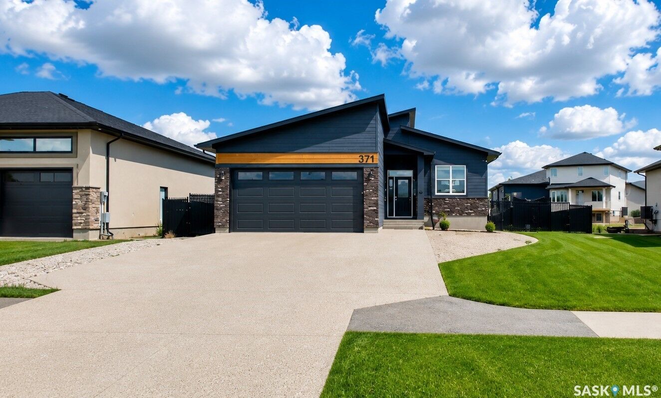 Property Photo:  371 Emerald Park Road  SK S4L 0A7 