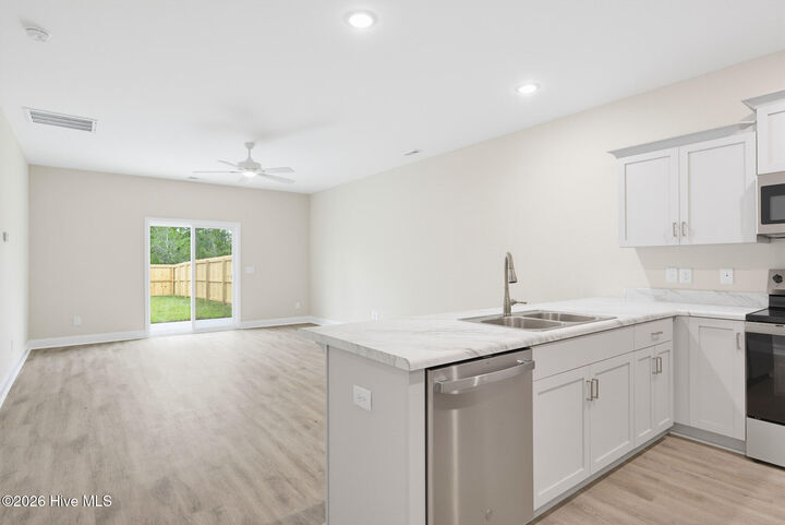 Property Photo:  310 Coastal Reef Court  NC 28445 
