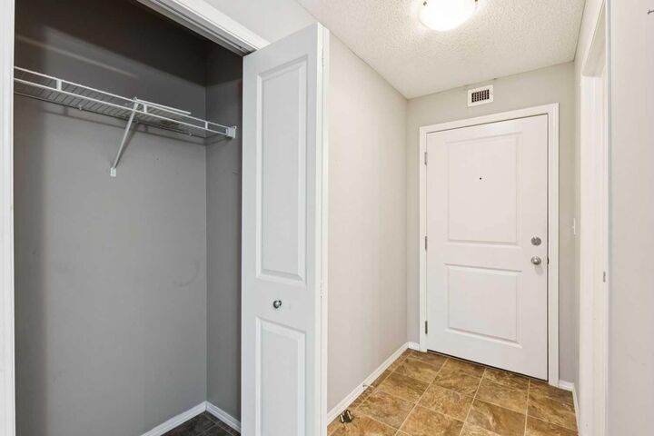 Property Photo:  403 Mackenzie Way SW 3108  AB T4B 3V7 
