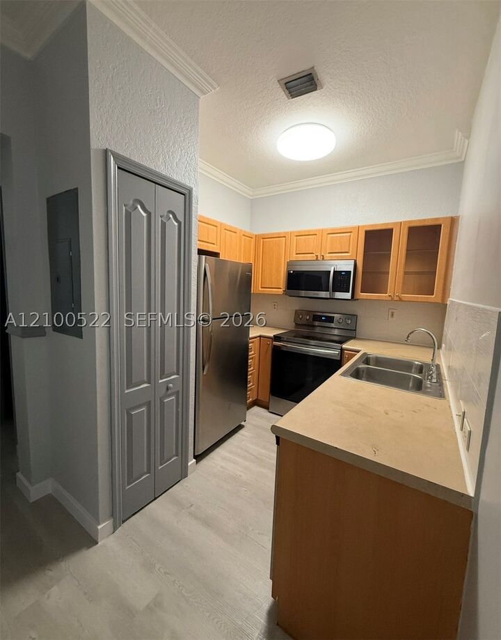 Property Photo: 17800 NW 73rd Ave 205-21 FL 33015