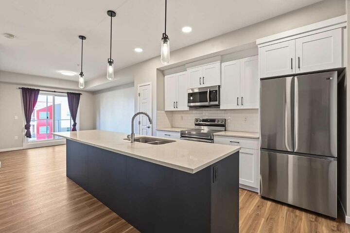 Property Photo:  19489 Main Street SE 2415  AB T3M 3J3 