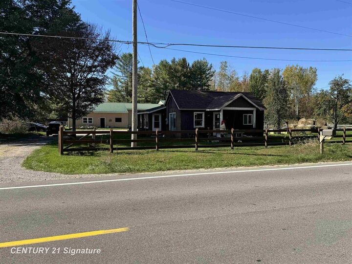 Property Photo:  1232 S Eight Mile Road  MI 48640 