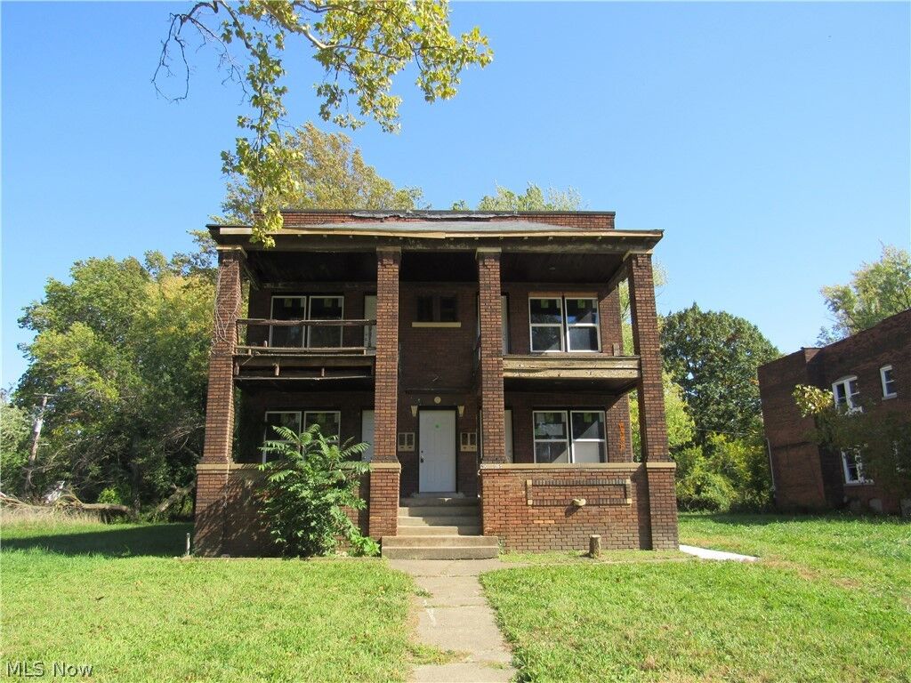 Property Photo:  1231 E 124th Street  OH 44108 