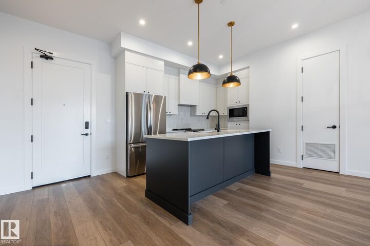 Property Photo:  7459 May Common NW 102  AB T6R 0X6 