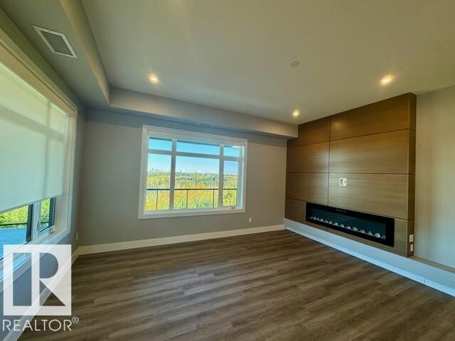 Property Photo: 7471 May Common NW 410 AB T6R 0X5