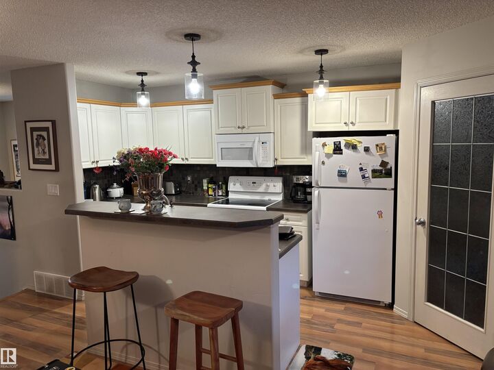 Property Photo: 711 Kananaskis Drive AB T9G 2G7