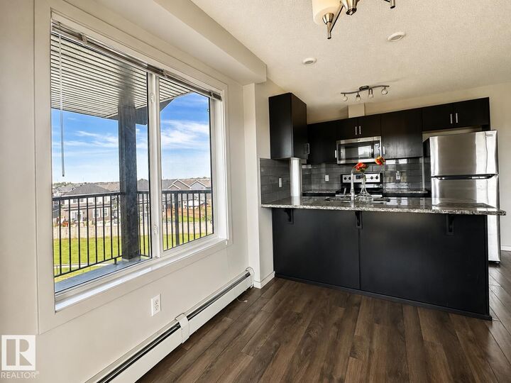 Property Photo:  142 Ebbers Boulevard NW 419  AB T5Y 3W2 