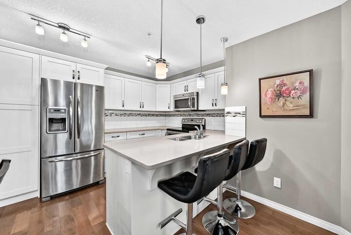 Property Photo:  130 Panatella Street NW 1305  AB T3K 0Y6 