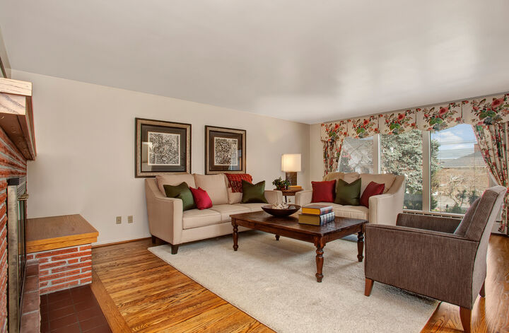Property Photo: Spacious living room with fireplace and hardwood floors 1859 40th Avenue E  WA 98112 