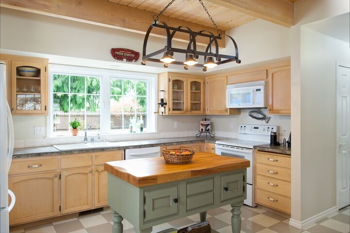 Property Photo: Kitchen and dining 4707 Cypress Dr WA 98221