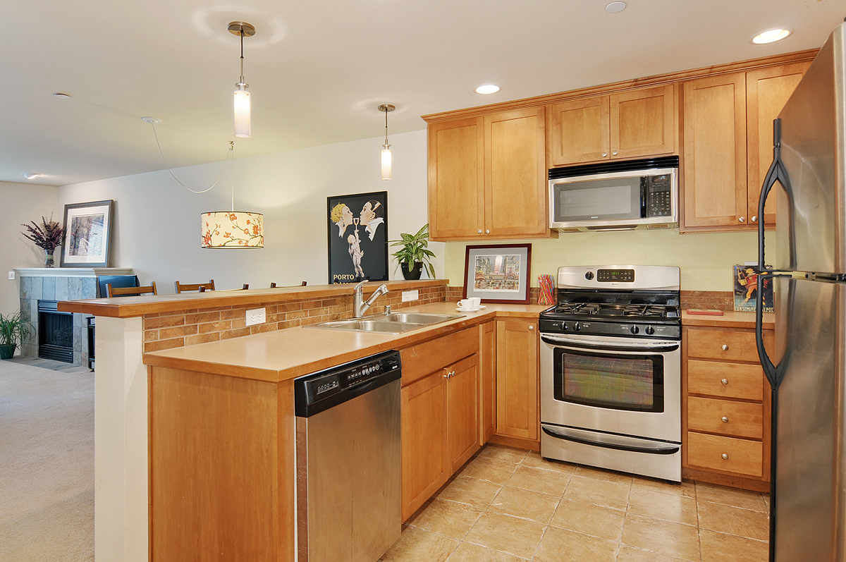 Property Photo: Kitchen/dining area/living room 4752 41st Ave SW 306 WA 98116