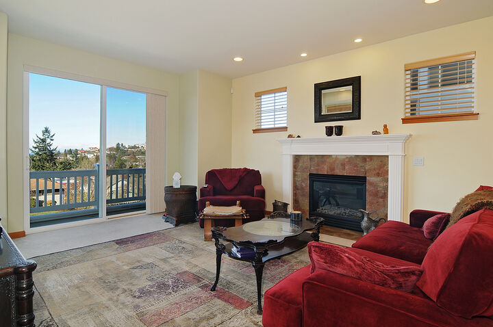 Property Photo: Living room/dining room/kitchen/family room 4840 46th Ave SW WA 98116